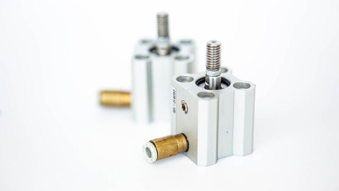 Home a-couple-of-white-cylinders-sitting-next-to-each-other-5bpommr-mdi